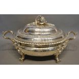 A George III Silver Soup Tureen, the cover mounted with an opening pomegranate above a two handled