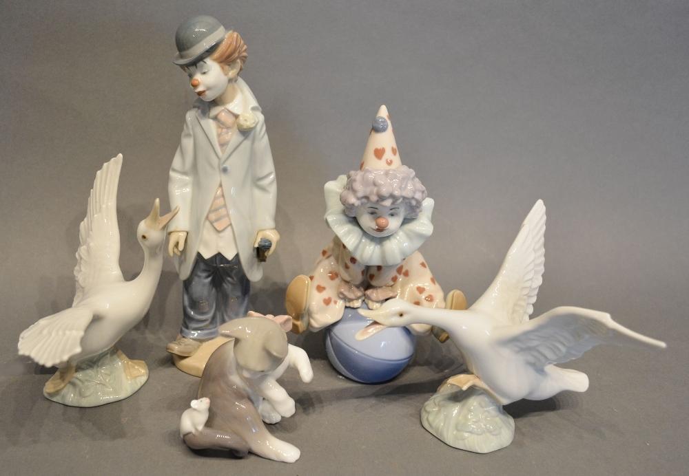 Two Lladro Porcelain Models of Clowns, together with a Lladro porcelain model of a cat and two