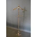 A Nickel Plated Valet Stand with circular pedestal base,138 cms tall