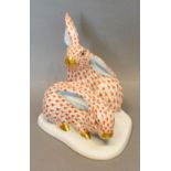 A Herend Porcelain Group in the form of two hares, 14cm tall