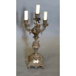 A 19th Century French Gilt Metal Four Branch Candelabrum converted to electricity, 43 cms tall