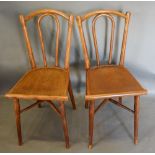 A pair of Bentwood Chairs by Thonet, the shaped backs above moulded seats raised upon turned legs
