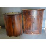 A 19th Century Mahogany Bow Fronted Hanging Corner Cabinet, together with another similar and A