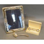 A 925 Silver Rectangular Photograph Frame, together with a Birmingham silver sugar sifter spoon