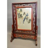 A Chinese Hardwood Table Screen, the double sided silk work panel depicting a bird amongst