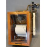 A 10" W G Pressure Instrument in glazed cabinet