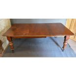 A Victorian Mahogany Pull Out Extending Dining Table, the moulded top above a plain frieze raised