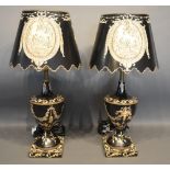 A Pair Of Painted Toleware Table Lamps Each Decorated with a reserve and hand painted with bows