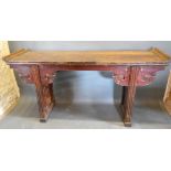 A 19th Century Chinese Hardwood Altar Table, the shaped top above a similar frieze with pierced