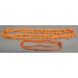 A Long Coral Necklace, together with another similar