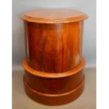 A Victorian Mahogany Work Box of Cylindrical Form, the hinged top enclosing a fitted interior raised