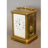 A 19th Century French Brass Cased Carriage Clock, the enamelled dial with Roman numerals and lever