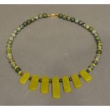 A Chinese Jade Necklace with 9 carat gold clasp