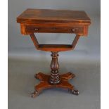 A Victorian Rosewood Games Work Table, The Hinge Top above a frieze drawer, raised upon a turned