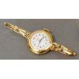 A Rolex 9 Carat Gold Cased Ladies Wristwatch, the enamelled dial with Arabic numerals and with 9