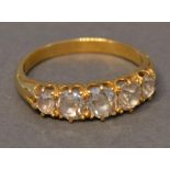 An 18 Carat Gold Five Stone Diamond Ring, the five graduated diamonds within a pierced setting
