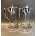 A Pair of London Silver and Plain Glass Claret Jugs, each with a Shaped Handle, makers JB Ltd. 27