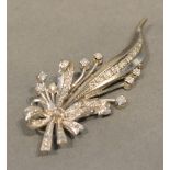 An 18 Carat White Gold and Diamond Set Spray Brooch, set with many diamonds, 5cm long