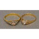 An 18 Carat Gold Solitaire Diamond Ring, together with a similar 9 carat gold solitaire diamond ring