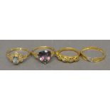 A Collection of Four 9 Carat Gold Dress Rings set with various stones