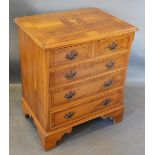 A Reproduction Yew Small Chest, the marquetry inlaid top above two short and thee long drawers
