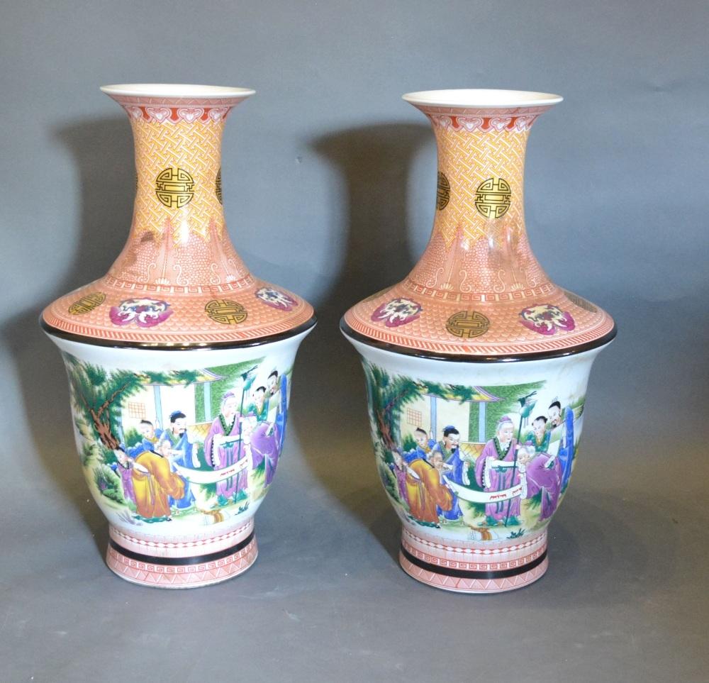 A Pair of Canton Porcelain Large Floor Vases, each decorated in polychrome enamels with Figures