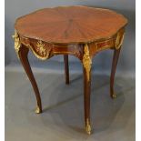 A French Kingwood And Gilt Metal Mounted Centre Table, the shaped top above a similar frieze, raised