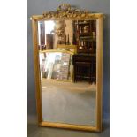 A 20th Century Giltwood Overmantel Mirror of rectangular form with pierced bow cresting, 142 x 77cm