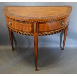 A 19th Century French Demi Lune Side Table, the crossbanded and inlaid top above two drawers with