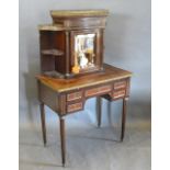 A 19th Century French Bonheur du Jour, the marble topped and brass galleried super structure with