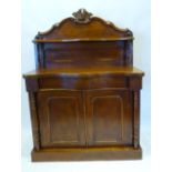 A Victorian Mahogany Serpentine Chiffonier The Shelf Back above a concealed drawer and two