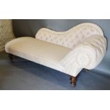 A Victorian Chaise Longue, the button scroll end raised upon turned legs, brass caps and castors,