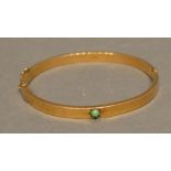 A 9 Carat Yellow Gold Bangle set with turquoise, 6.4 grammes