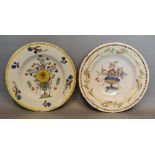 An 18th Century Delft Dish decorated in polychrome enamels, 23 cms diameter, together with another
