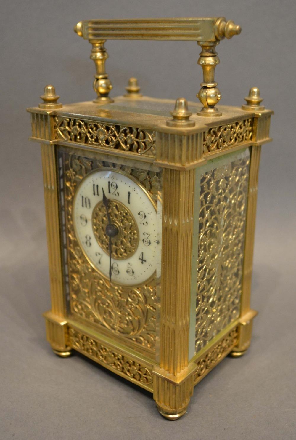 A 19th Century French Brass Cased Carriage Clock, the enamelled dial with Arabic numerals and with