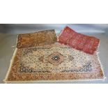 A North West Persian Woollen Rug, the central medallion within an allover design upon a white and