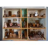 A Large Dolls House in the Georgian Style complete with a large collection of dolls house