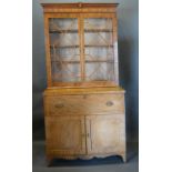 A Regency Mahogany Secretaire Bookcase, the moulded and shell inlaid cornice above two astragal