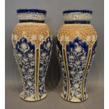 A pair of Doulton Lambeth Stoneware Oviform Vases decorated in relief with a foliate design upon a