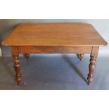 A Victorian Rectangular Farmhouse Kitchen Table, the moulded top above a plain frieze raised upon