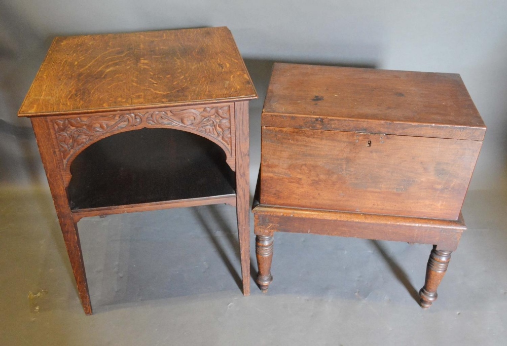 A 19th Century Oak Cellarette with a hinged cover raised upon turned legs, together with an Art