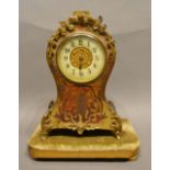 A 19th Century Boulle Mantel Clock, the enamelled dial with Arabic numerals upon a gilded and fabric