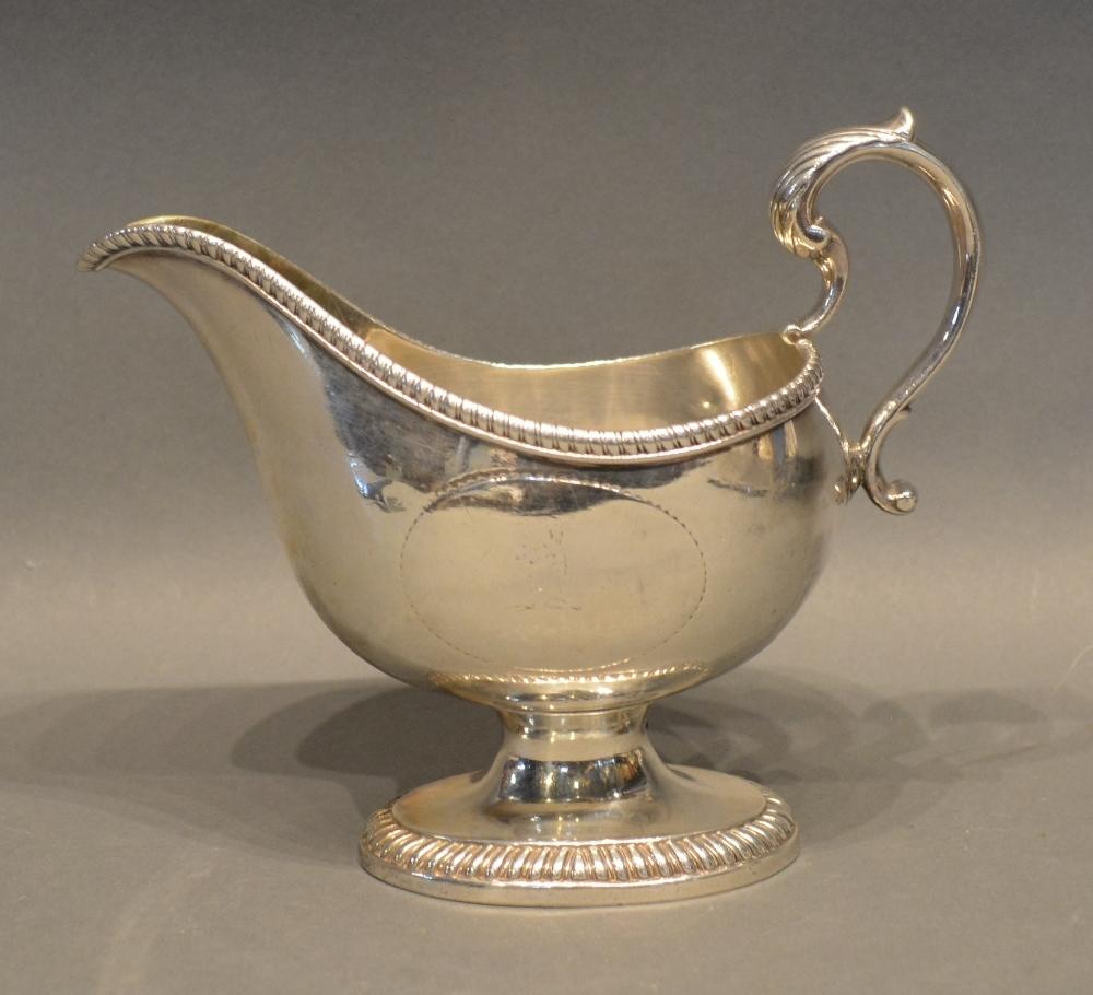 A George III Silver Sauce Jug With Oval Pedestal Base And Shaped Handle, London 1784, makers mark SI
