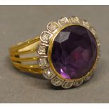 An 18 Carat Yellow Gold Large Amethyst and Diamond Cluster Ring set with large circular amethyst