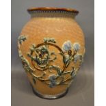 A Royal Doulton Stoneware Jardiniere decorated in relief with a foliate design, 32cm tall