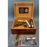 A Burr Walnut Humidor containing various cigars