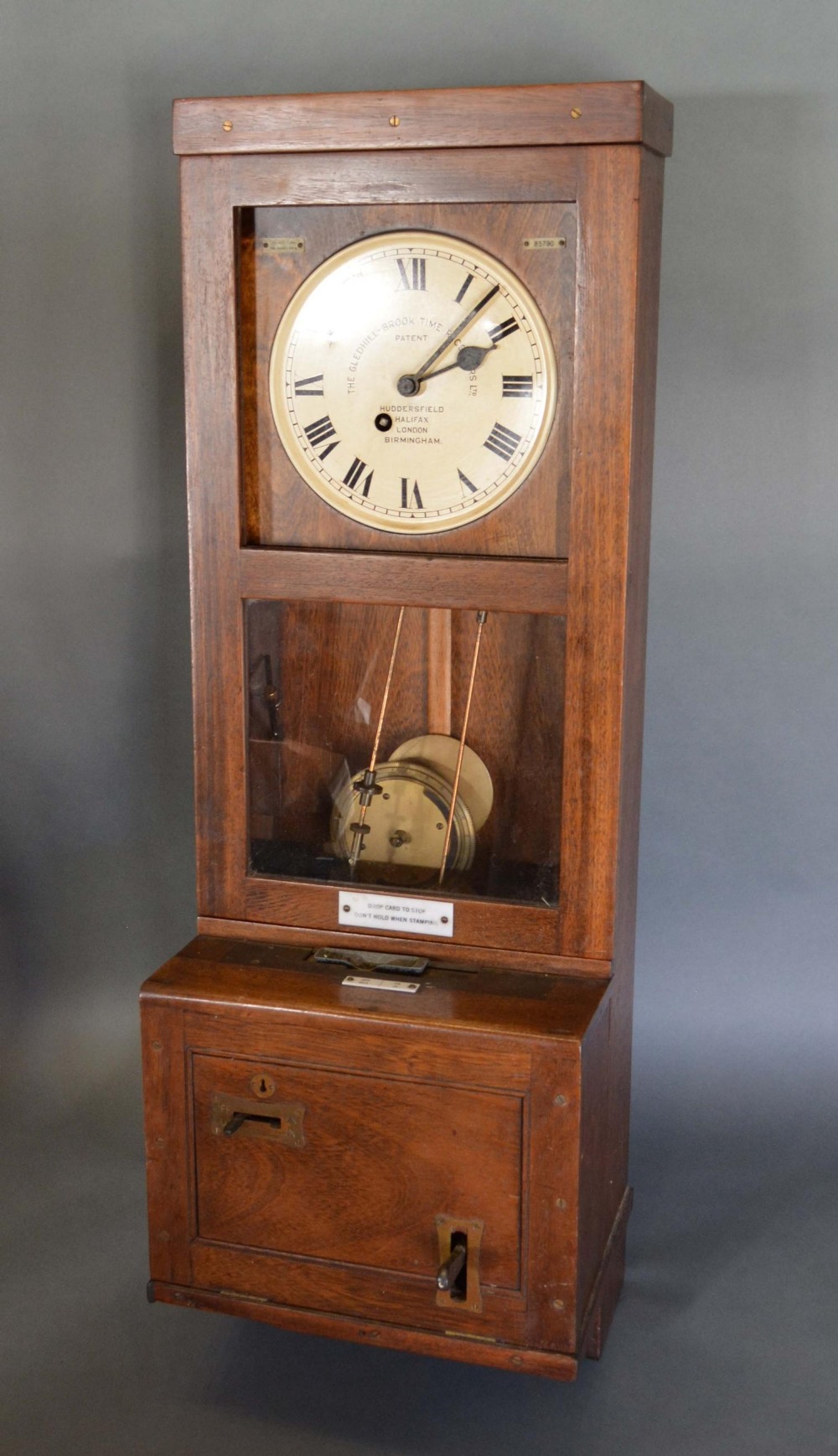 A Gledhill-Brook Time Recorder Clock, oak cased, 114cm high