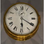 A Circular Brass Ship's Clock by Sestrel, 18cm diameter