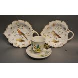 A Pair of German Porcelain Pickle Dishes of leaf form, hand painted with birds amongst foliage,