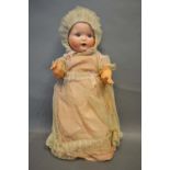 A British National Dolls Bisque Head Doll with jointed limbs, 50cm tall
